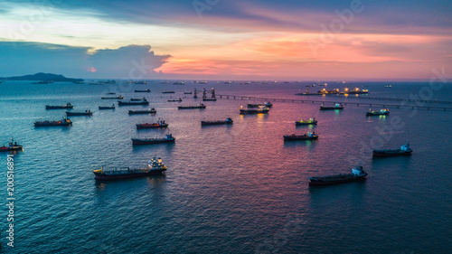 Aerial view tanker ship anchor parking in sea, Crude oil tanker ship and LPG tanker ship loading in bay at sunset, Bulk boat anchor. 