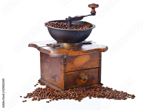 Coffee grinder and roasted coffee beans isolated on white background