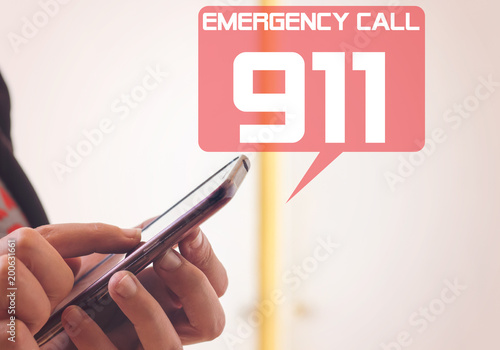 woman dialing emergency (911number) on smartphone