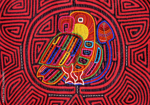 Cuna Mola panel with bird motif. The panels are made using the reverse appliqué technique to expose colorful underling layers, San Blas Islands, Panama