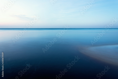 horizontal line of calm sea on the day light