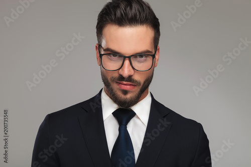 handsome businessman with sunglasses showing contempt