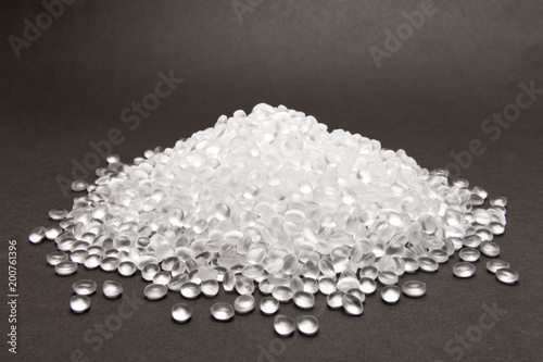 Transparent Polyethylene granules on dark .HDPE Plastic pellets. Plastic Raw material . IDPE.