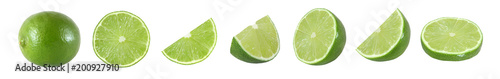 Collection of whole and cut lime fruits isolated on white background with clipping path