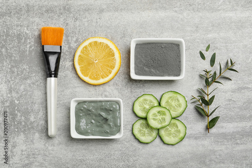 Homemade effective acne remedies and ingredients on grey background, flat lay