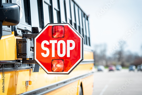 School bus stop sign with flashing lights