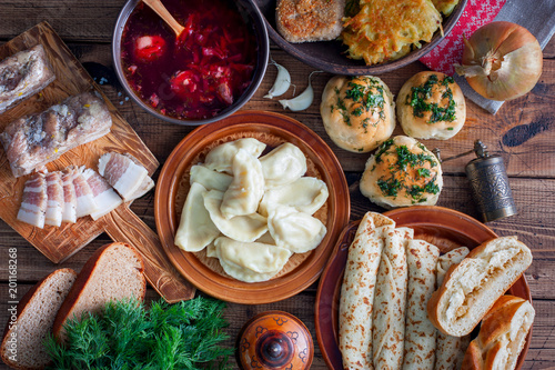 Covered table with traditional Ukrainian food, top view, horizontal