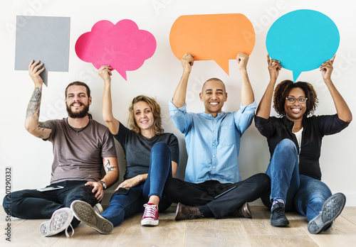 People carrying speech bubble icons