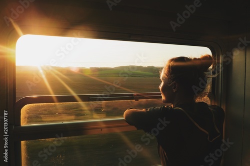 caucasian woman traveling by train