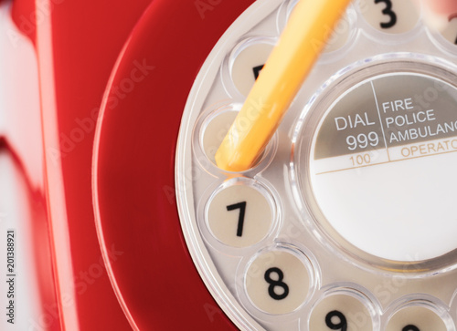 Close Up of Retro Telephone Dial with Pencil