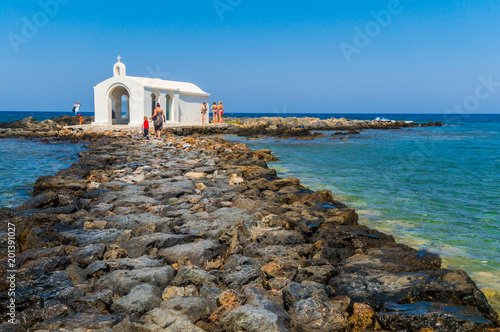 Small white Saint Nicolas chapel by the sea at Georgioupoli in Chania, Crete, Greece