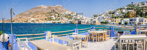 Beautiful white blue windmills of mediterranean greek villages called Agia Marina and Panteli with beautiful views to mountain and over the bay, Leros Island, Dodecanese, Greece