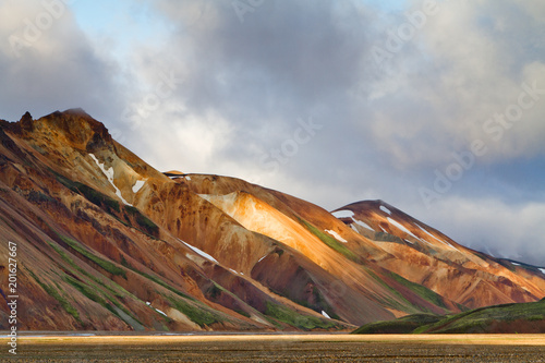 Icelandic mountain landscape at sunset. Colorful volcanic mountains in the Landmannalaugar geotermal area. One of the parts of Laugavegur trail