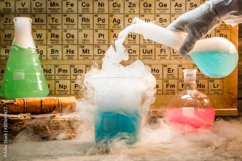 University chemical lab during experiment with periodic table of elements