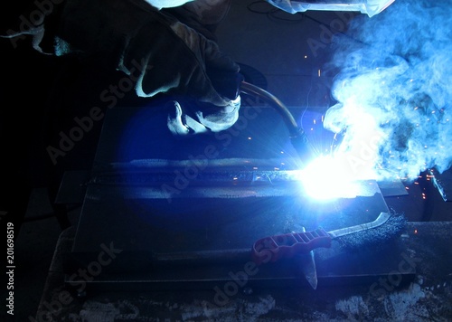 Example of correct position and posture and keeping the welding gun by an experienced welders