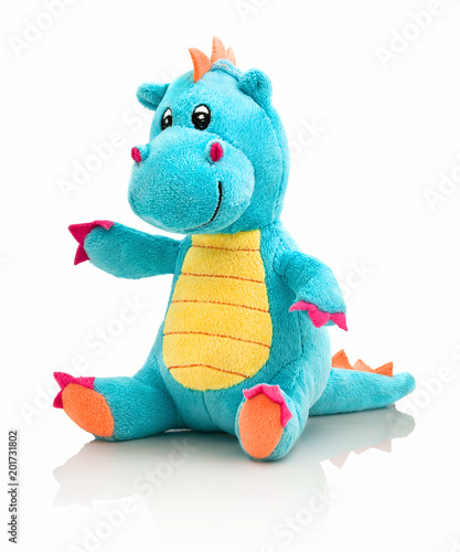 Dragon plushie doll isolated on white background with shadow reflection. Dragon plush stuffed puppet on white backdrop. Dino plushie toy. Aqua color stuffed dinosaur toy. Lizard toy sitting on white