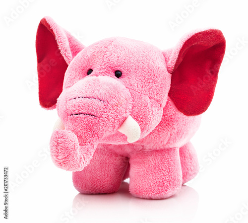 Plush pink elephant for little kids isolated on the white background with shadow reflection. Front view of soft pink animal toy for small kids for playing. Stuffed pink elephant with red ears