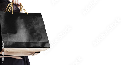 Black friday sale concept of young woman holding shopping bag isolated on white background with copy space