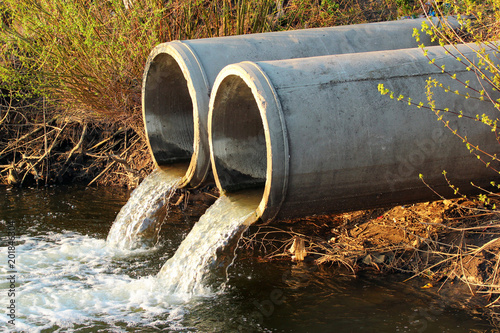 Discharge of sewage into a river