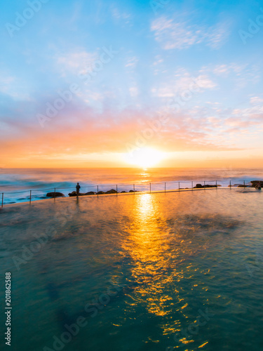 Sunrise by the rock pool at Bronte Beach, Sydney.