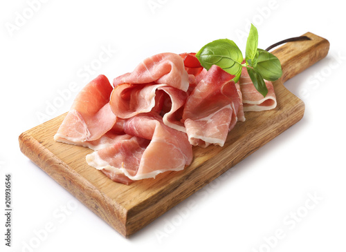 prosciutto on wooden cutting board