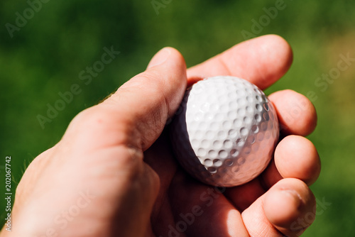 Golfer holding golf ball