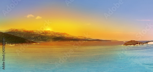 Panoramic Sunrise over the sea and famous Greek island Corfu, aerial shot