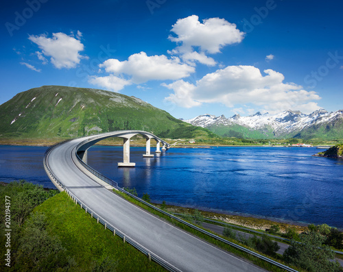 Norway famous bridge with mountains in background. Beautiful road over river in nature.
