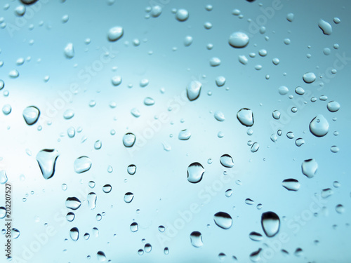 rain droplets on the glass and blue background