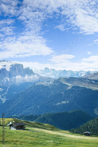 beautiful mountain landscape with wooden house in summer time in Dolomites Apl