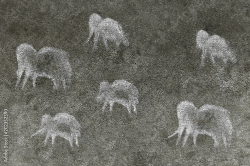 a herd of ancient animals painted by an ancient man on a cave wall. ancient history.