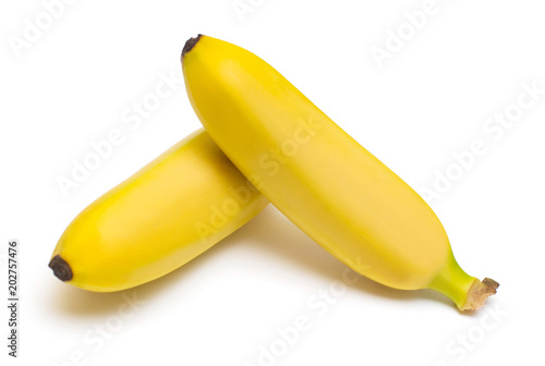 Two baby banana against white background. Flat lay, top view. Flat lay, top view. Yellow Fruit