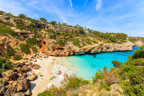 Unidentified people playing on beach, Cala des Moro, Majorca island, Spain