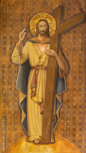 ZARAGOZA, SPAIN - MARCH 1, 2018: The painting of Resurrected Jesus Christ with the cross in church Iglesia del Perpetuo Socorro by pater Jesus Faus (1953 - 1959).