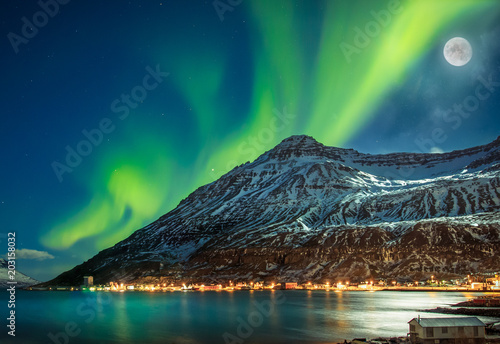 Aurora borealis over fjord town Seydisfjordur, Iceland