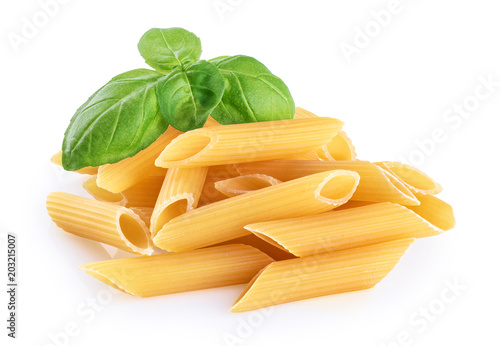 Penne rigate pasta and basil isolated on white background. Raw.