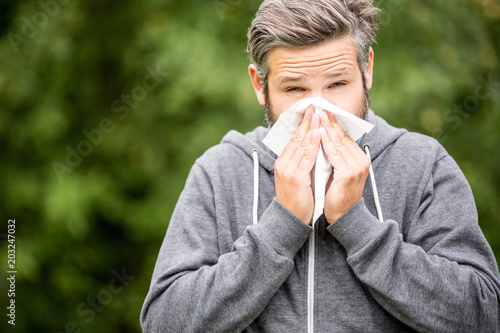 Man with allergy or ill with hay fever