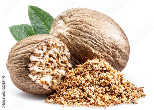 Dried seeds of fragrant nutmeg and grated nutmeg isolated on white background.