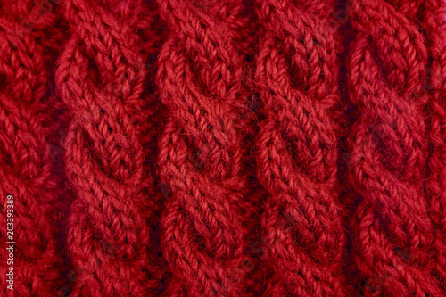 Detail of red cable knitting stitch