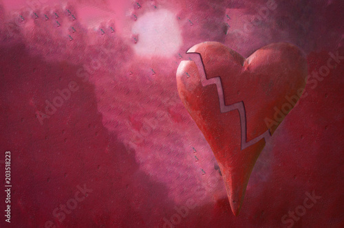 gebrochenes Herz vor rotem, diffusen Hintergrund