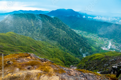 dramatic landscape view of mountains and valley from sibayak volcano in sumatra indonesia
