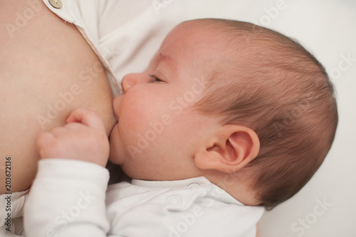 Brest feeding - 3 months old baby boy being brest fed