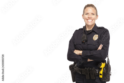 Female police officer posing with arms crossed