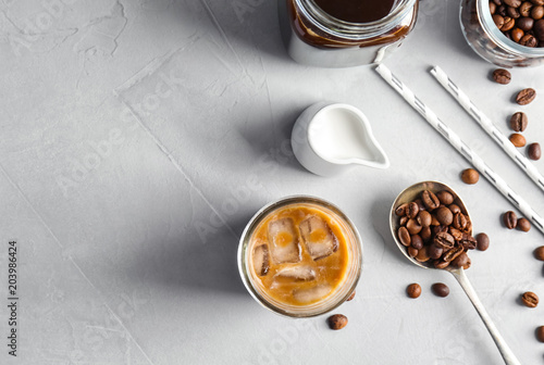 Flat lay composition with cold brew coffee and milk on grey background