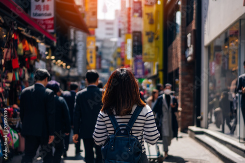 Young asian woman traveler traveling and shopping in Myeongdong street market at Seoul, South Korea. Myeong Dong district is the most popular shopping market at Seoul city.