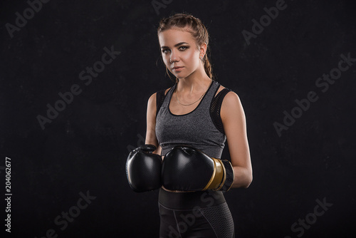 Sports girl in boxing gloves