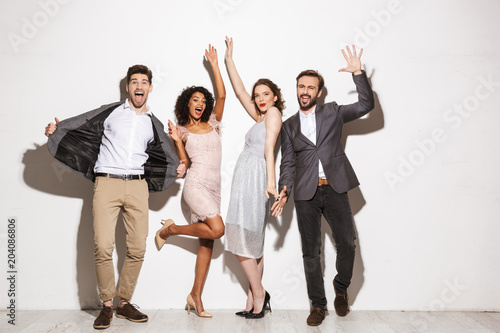 Group of cheerful well dressed multiracial people