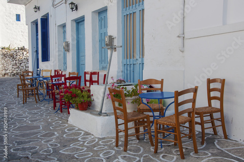 Outdoor part of a taverna on the street of Kimolos island in Greece