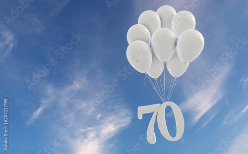 Number 70 party celebration. Number attached to a bunch of white balloons against blue sky