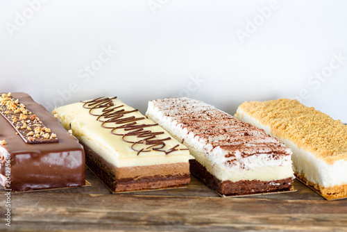 Beautiful Delicious dessert cheesecakes and chocolate cake. Group of four different types of sweet for holiday Shavuot.